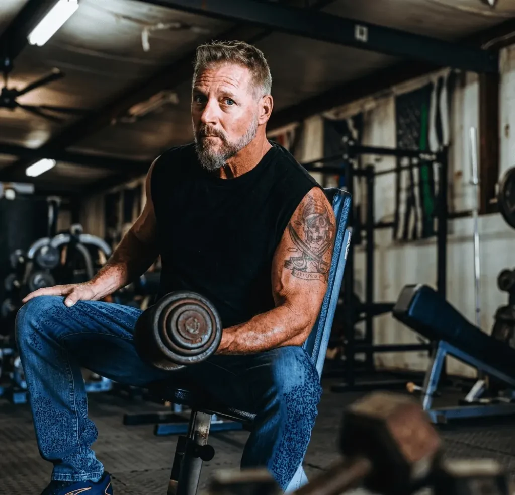 Iron Rooster Fitness coach in a gym environment focused on strength and performance